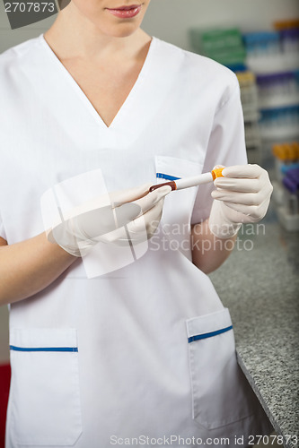 Image of Researcher Analyzing Sample In Laboratory