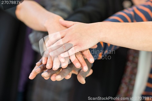 Image of Multiethnic University Students Stacking Hands