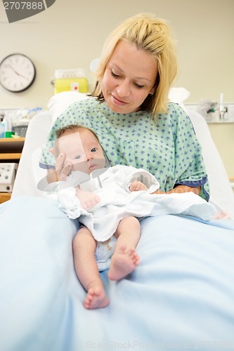 Image of Newborn Baby Girl With Mother In Hospital