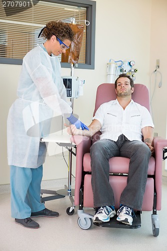 Image of Nurse Injecting Cancer Patient During Intravenous Treatment In H