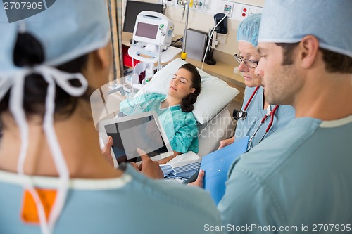 Image of Nurses and Patient in Post Op Unit in Hospital