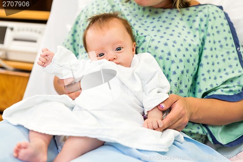 Image of Newborn Baby Girl Sitting With Mother In Hospital