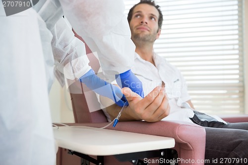 Image of Patient Looking At Nurse While Receiving Intravenous Treatment I