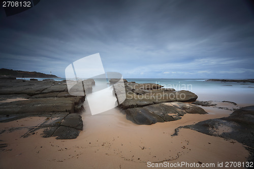 Image of Stormy beach with natural rock channel Soldiers Beach point