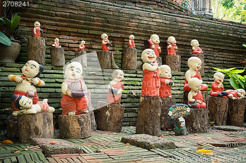 Image of Funny little concrete statues at the walls of the ancient temple