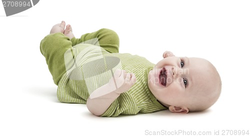 Image of happy toddler lying on his back