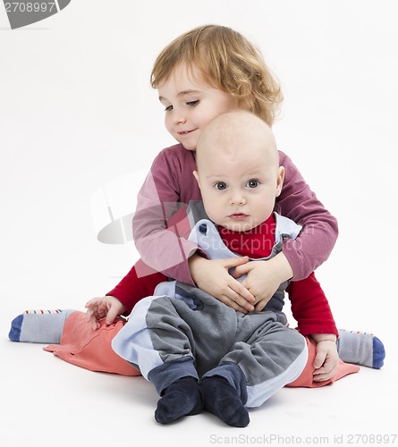 Image of siblings isolated in light background