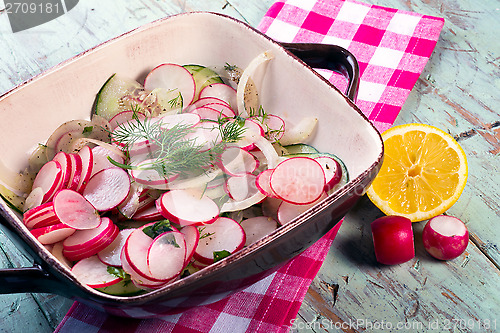 Image of Radish cucumber and onion salad.