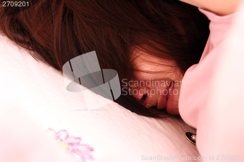 Image of Young woman sleeping.