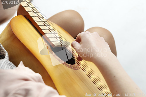 Image of Playing the guitar