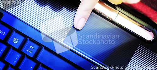 Image of Working at laptop .