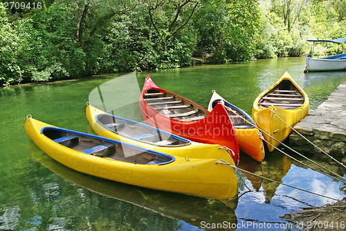 Image of yellow plastic canoes