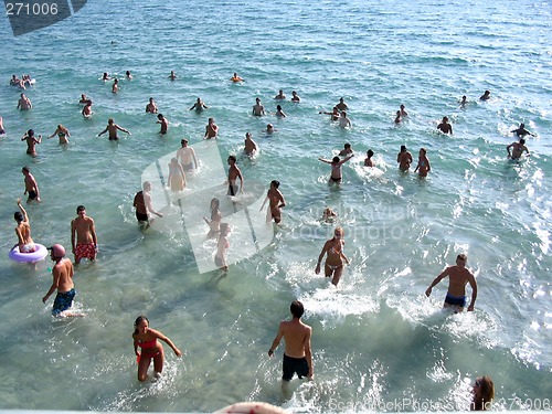 Image of Young people dance in the afternoon in the sea
