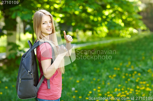 Image of Smiling woman student with backpack