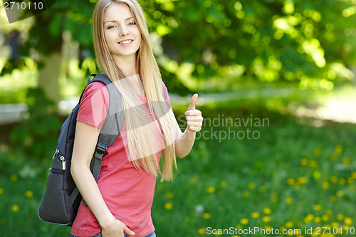 Image of Smiling woman student with backpack