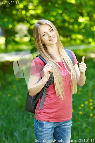 Image of Smiling woman student with backpack