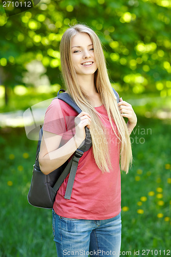 Image of Smiling woman student with backpack