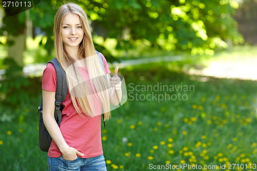 Image of Smiling woman student with backpack