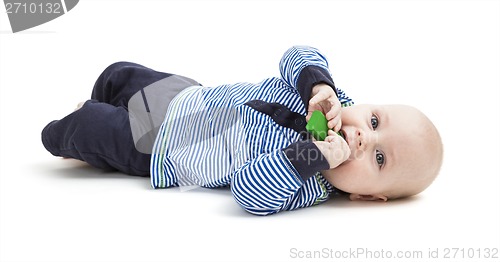 Image of toddler with toy on floor