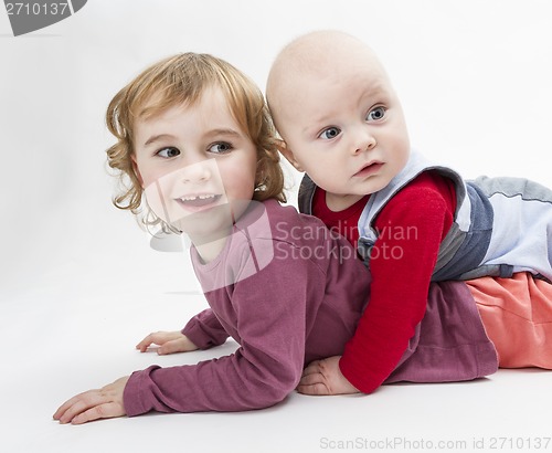 Image of two children playing on floor