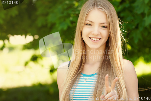 Image of Pretty young woman outdoors.