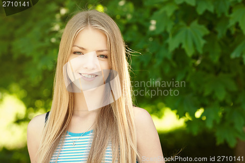 Image of Pretty young woman outdoors.