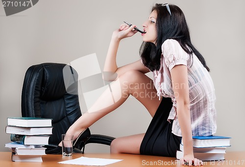 Image of Young woman on table