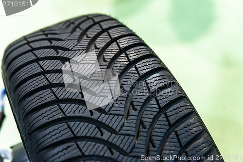 Image of New car tyre closeup photo