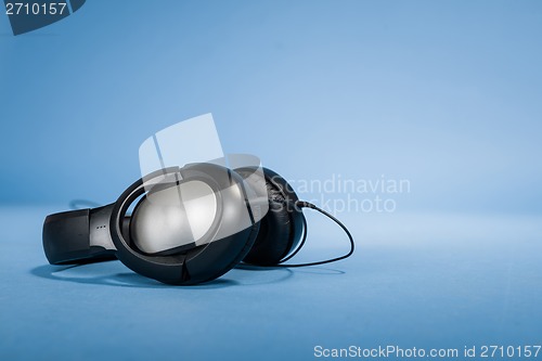 Image of Headphones against blue background