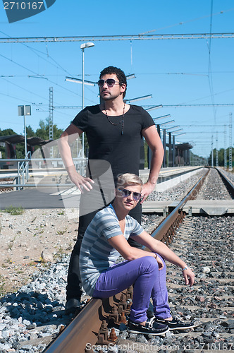 Image of Two guys on train tracks