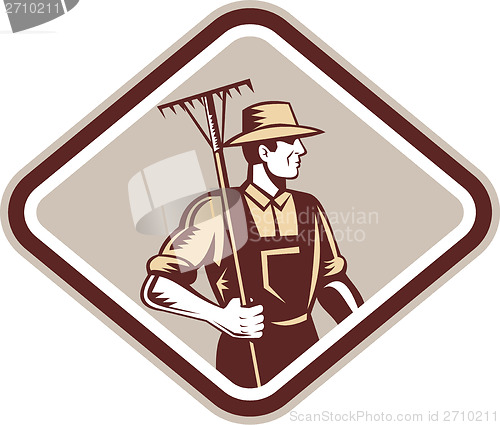 Image of Organic Farmer Holding Rake Side Woodcut