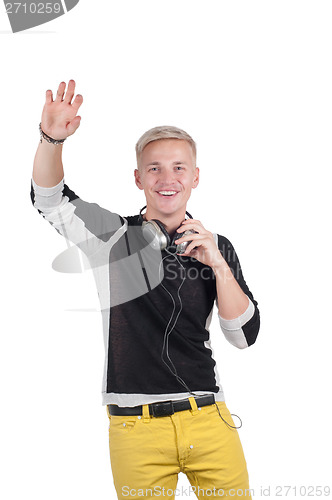 Image of Man with headphones raising his hand up