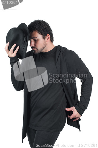 Image of Man in black dancing with hat