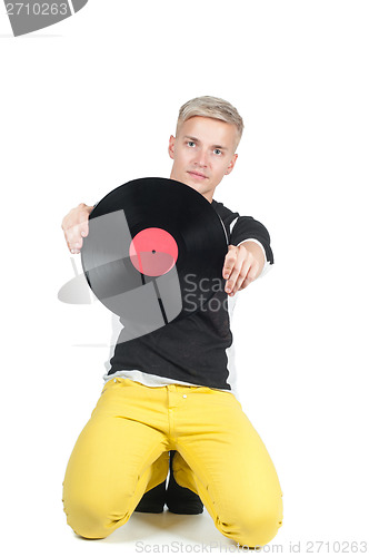 Image of Young man showing from vinyl record