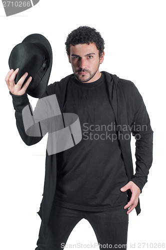 Image of Man in black with his black hat