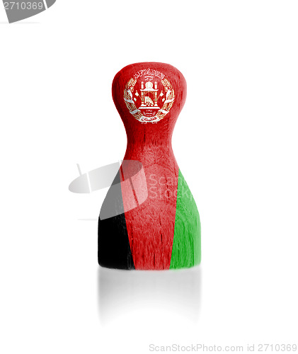 Image of Wooden pawn with a painting of a flag