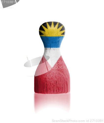 Image of Wooden pawn with a painting of a flag