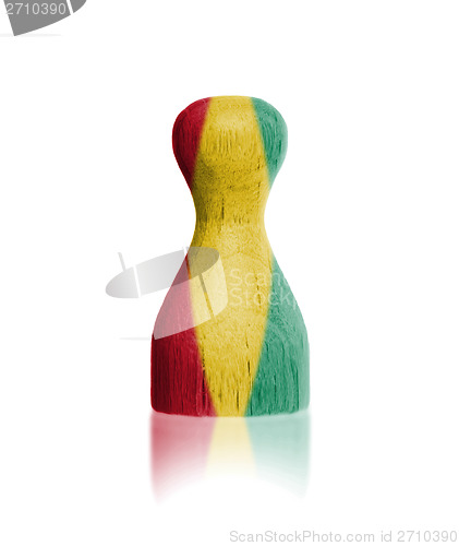 Image of Wooden pawn with a painting of a flag