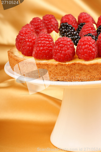 Image of Custard tart with raspberries and blackberries