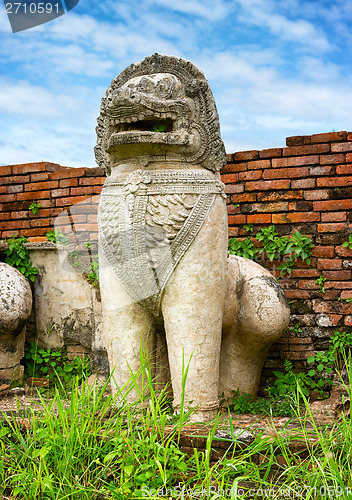 Image of Stone statue of a lion-like creature. Ayutthaya, Thailand