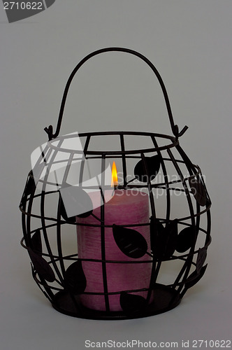 Image of Wire basket candle.