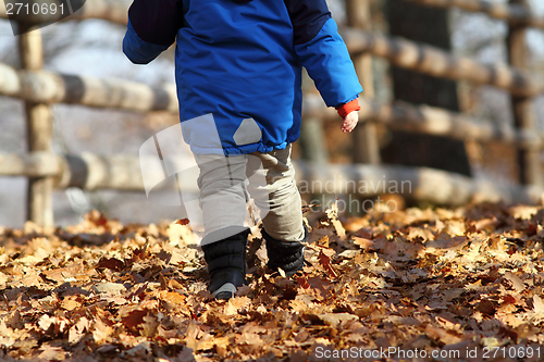 Image of child walking on rural road