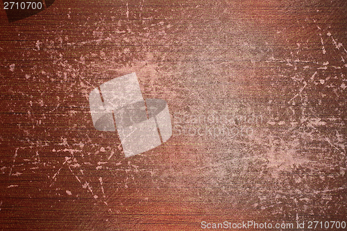 Image of orange scratched abstract material