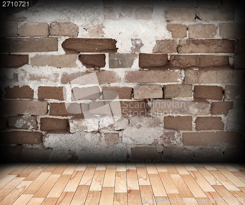 Image of cracked brick wall on interior backdrop
