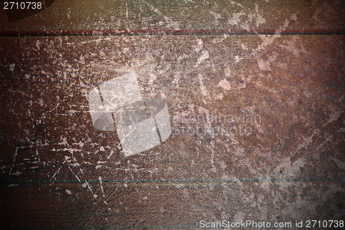 Image of abstract scratches on mahogany surface