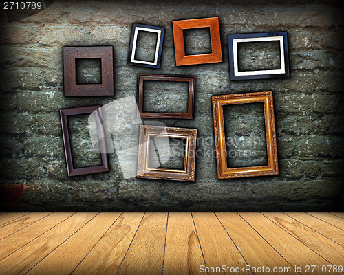 Image of scratched wall full of wood frames