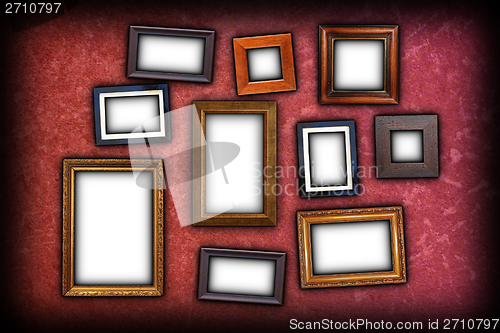 Image of red scratched wall with frames