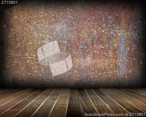 Image of indoor backdrop with distressed rusty wall