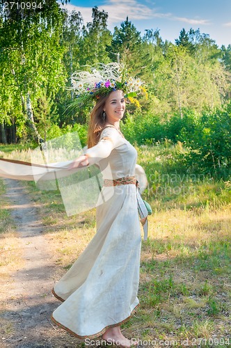 Image of Beautiful woman with flower wreath