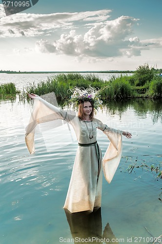 Image of Beautiful woman with flower wreath